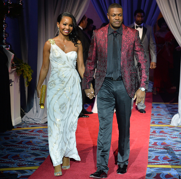 Cynne Simpson and Chris Tucker attend the 2014 UNCF Mayor's Masked Ball at Atlanta Marriot Marquis on December 20, 2014 in Atlanta, Georgia. (Photo by Prince Williams/FilmMagic)