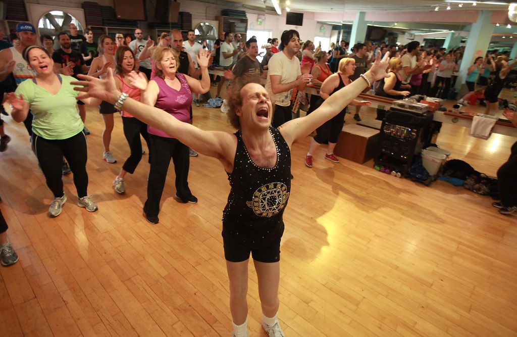 Fitness guru Richard Simmons sings alone with one the the 60s classic tunes playing during one of h