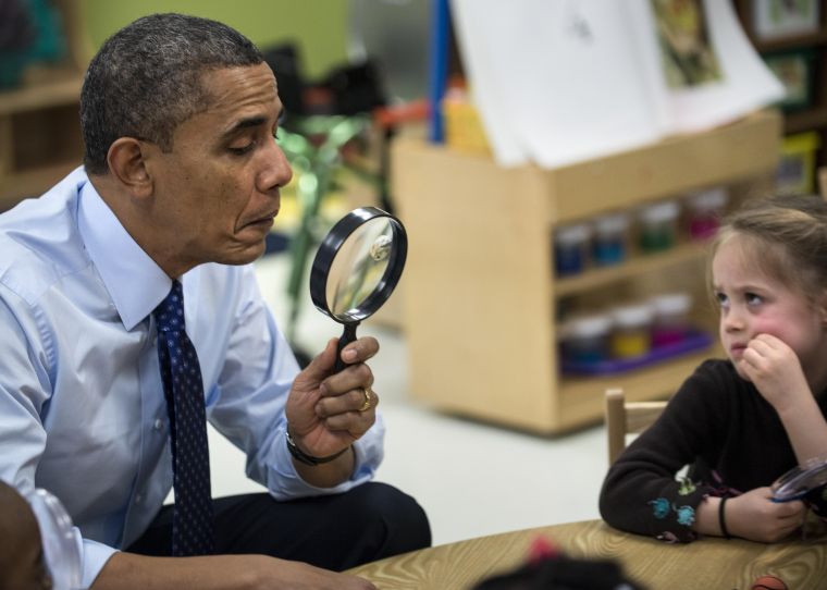 President Obama plays a learning game while visiting children at College Heights Early Childhood Learning Center in Decatur.