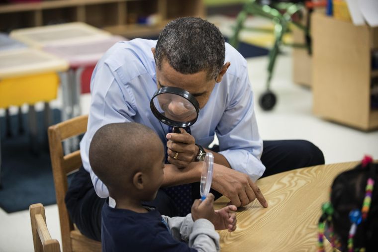 President Obama plays a learning game while visiting children at College Heights Early Childhood Learning Center in Decatur.