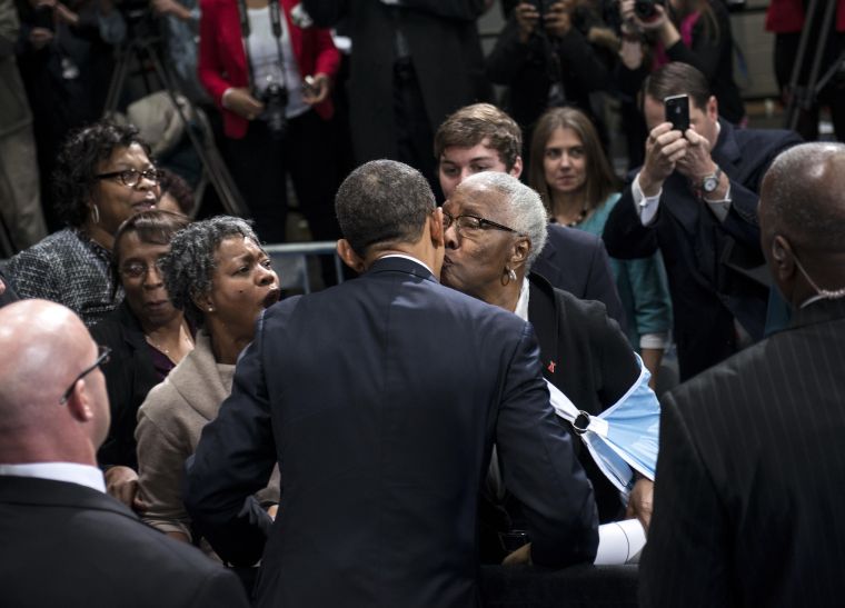President Obama is kissed by a supporter at the Decatur Community Recreation Center in Decatur.