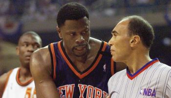 Patrick Ewing (C) of the New York Knicks argues wi