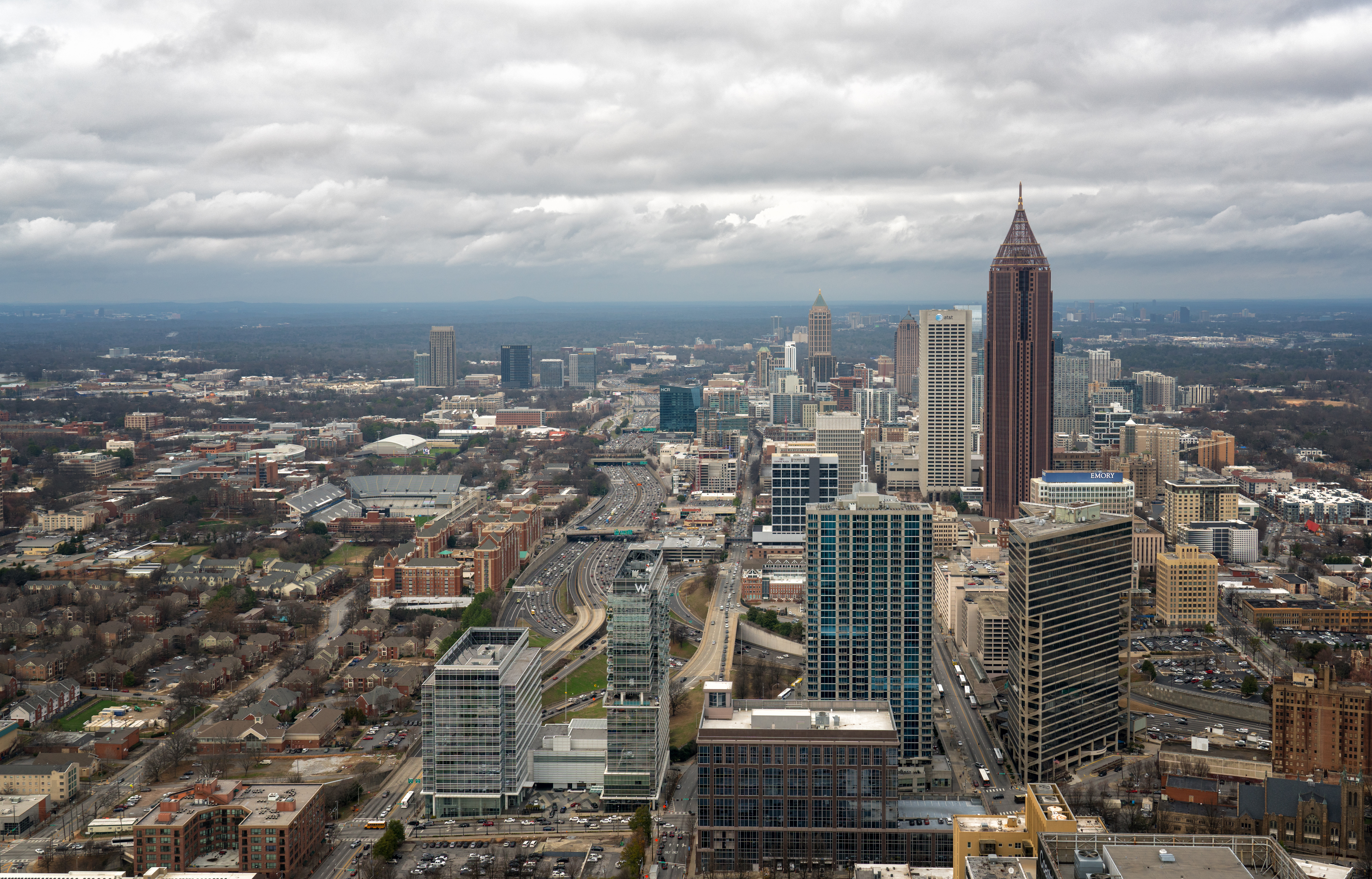 View Of Cityscape Against Cloudy Sky
