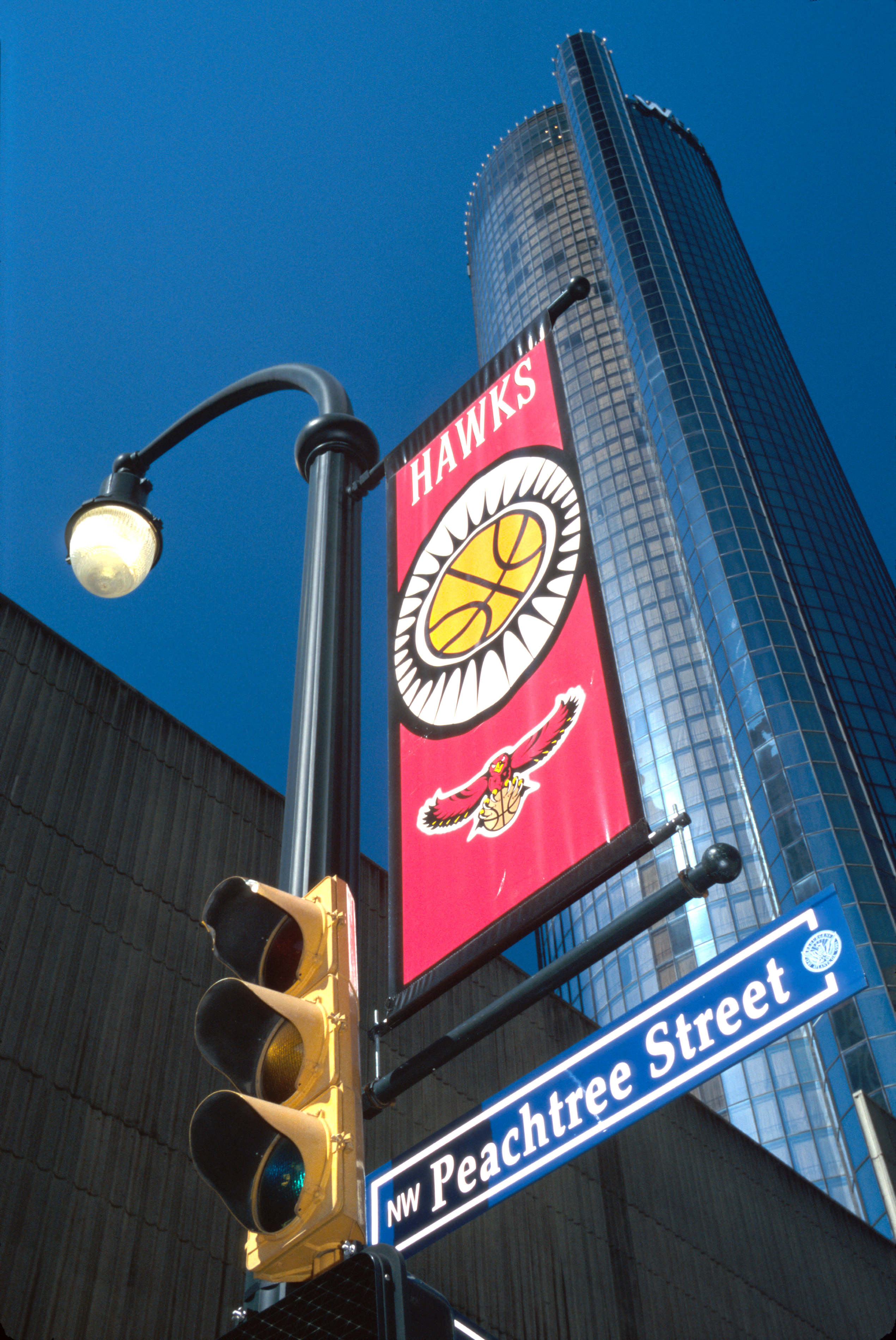 Peachtree Street sign and banner for Hawks National Basketball Association team.