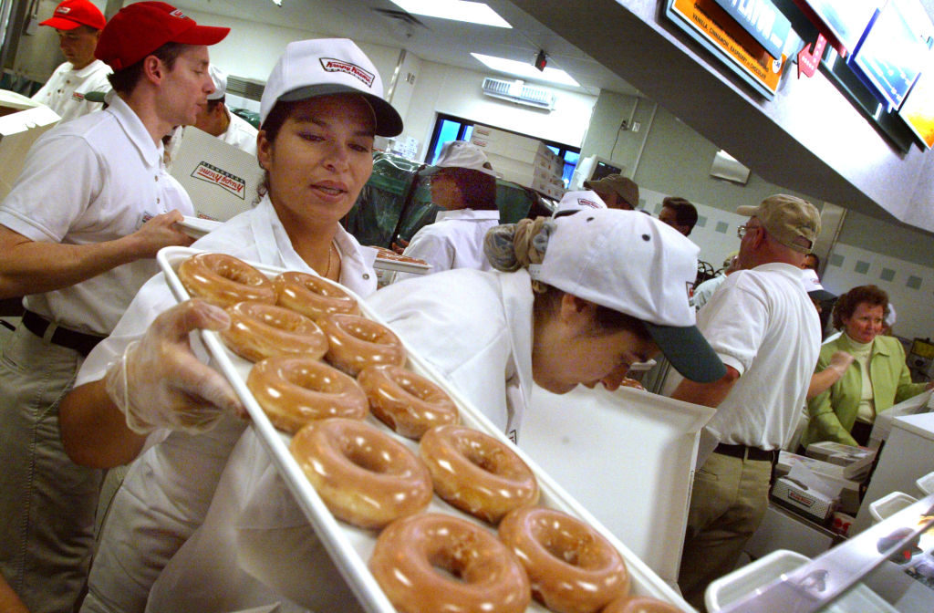 Maple Grove, MN. 4/23/02--Krispy Kreme made it's arrival this morning in Maple Grove. There were nearly 500 waiting in line when the doors opened at 5:30AM. A few had been there all night long. Krispy Kreme expects to sell at least a million doughnuts to