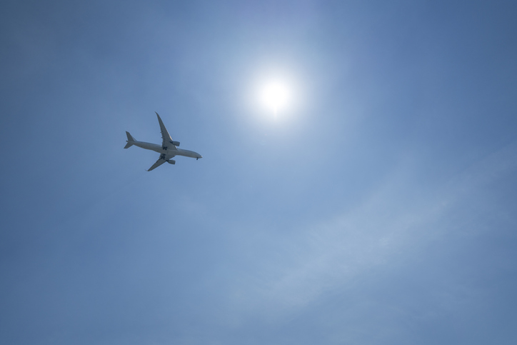 Directly Below Shot Of Airplane Flying In Sky