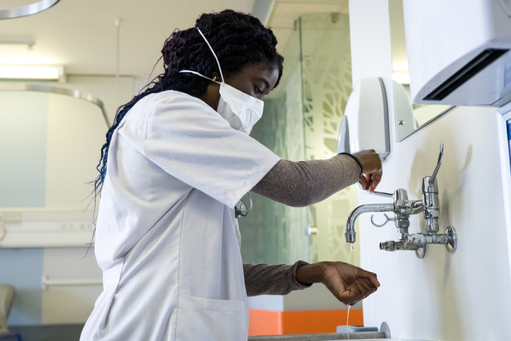 Female healthcare worker washing her hands