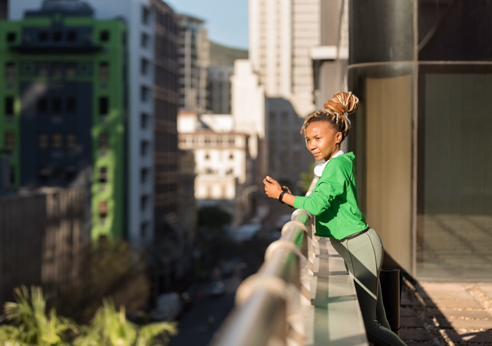 African woman looking over the cityscape