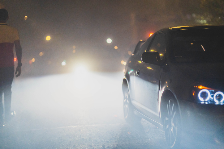 Cars Surrounded By Smoke After a Street Fireworks Show In New York City.
