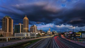 Atlanta skyline during rush hour and a stormy night