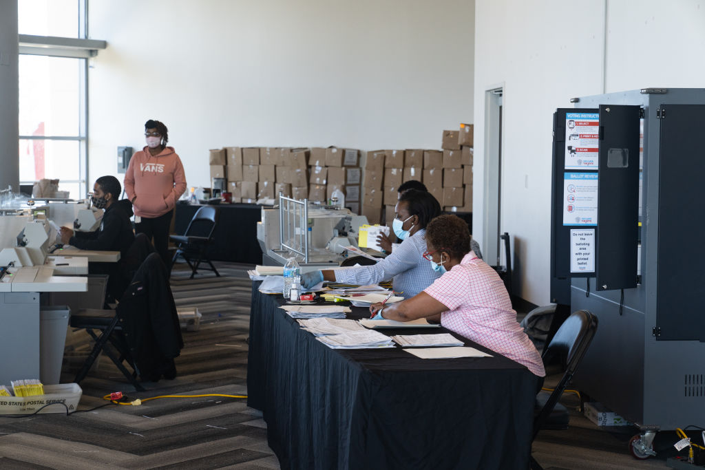 Fulton County Officials Process Absentee Ballots In Atlanta's State Farm Arena