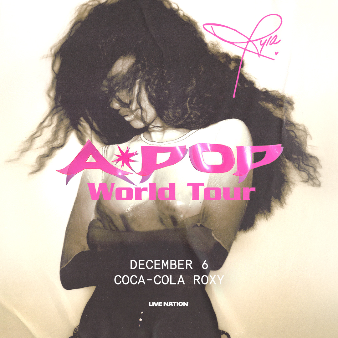 A concert poster for the A*Teens World Tour, featuring a close-up of a person with curly hair. The poster displays the tour name, date, and venue "Coca-Cola Roxy".